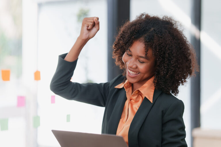 A businesswoman celebrates social media results